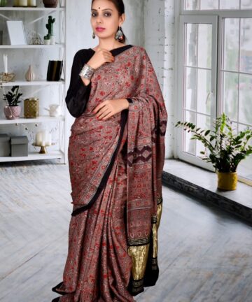 Handcrafted modal silk saree with traditional Ajrakh prints and Golden Border in vegetable dyes
