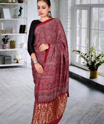 Handcrafted modal silk saree with traditional Ajrakh prints and Golden Border in vegetable dyes